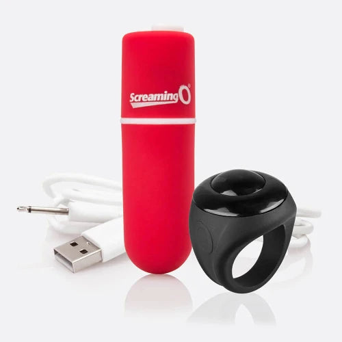 red bullet vibrator next to charger cord and black remote control ring