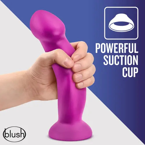 Suko Dildo With Suction Cup pink dildo against purple and white background