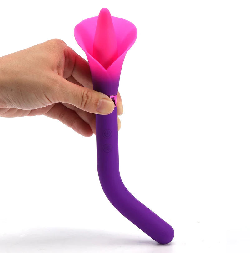 Hand holding VALA flower vibrator - purple toy with pink