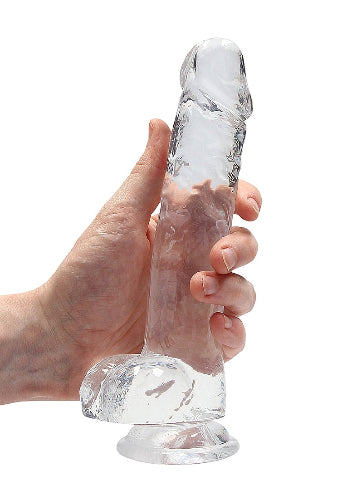 hand cradling clear dildo