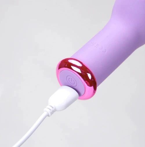 closeup of charging cord plugged into lavender vibrator