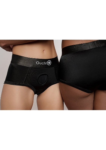 two models wearing black strap on panties with hips pressed together