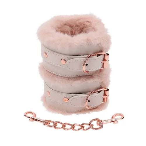 Peaches 'n CreaMe handcuffs - peach-colored fur-lined handcuffs stacked on top of one another with separate rose gold chain