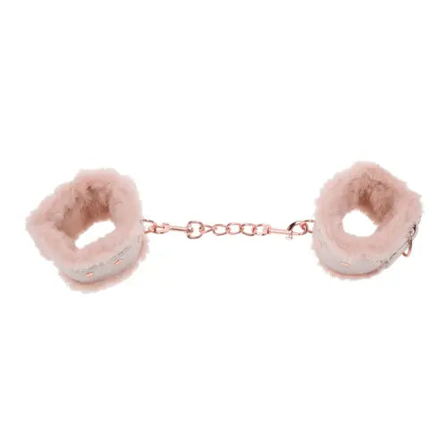 Peaches 'n CreaMe handcuffs - peach-colored fur-lined handcuffs attached by rose gold chain