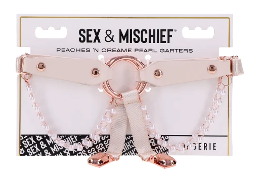 peach garters with rose gold accents and pearls on package