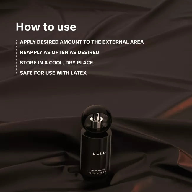 LELO personal moisturizer - black spray bottle against black silky background with how to use instructions