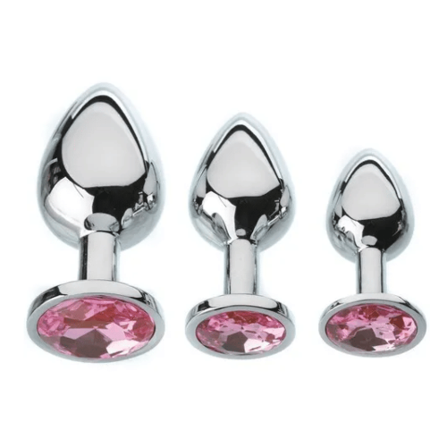 three metal butt plugs in varying sizes with sparkly pink gems