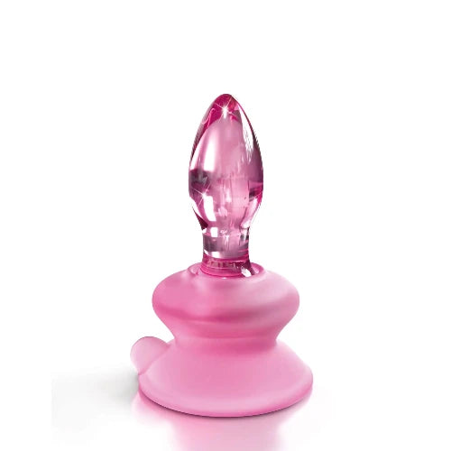 pink glass butt plug with white background
