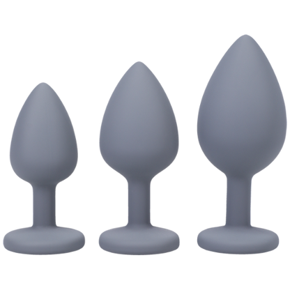 three gray silicone butt plugs in gradually increasing size