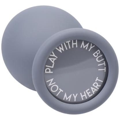 bottom of gray silicone butt plug - round base that says play with my butt, not my heart