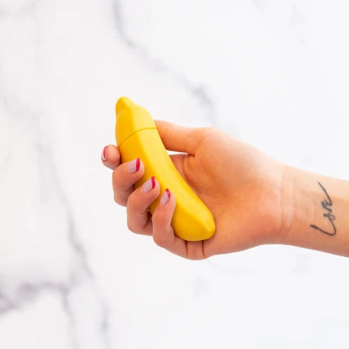 hand holding banana vibrator