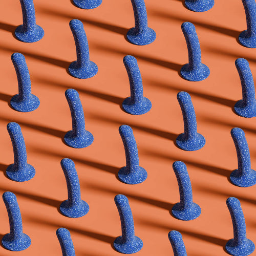 blue dildos on orange background