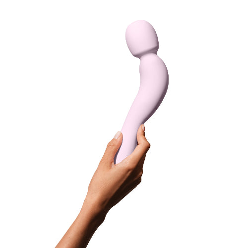 hand holding com wand vibrator quartz