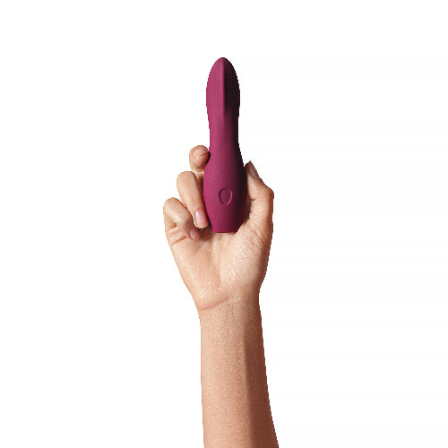 hand holding Dame Dip in plum