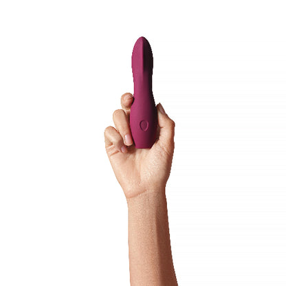 hand holding Dame Dip in plum