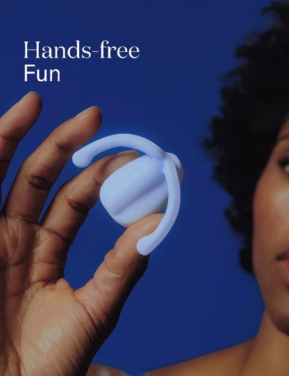 woman holding Eva ice color vibrator against blue background