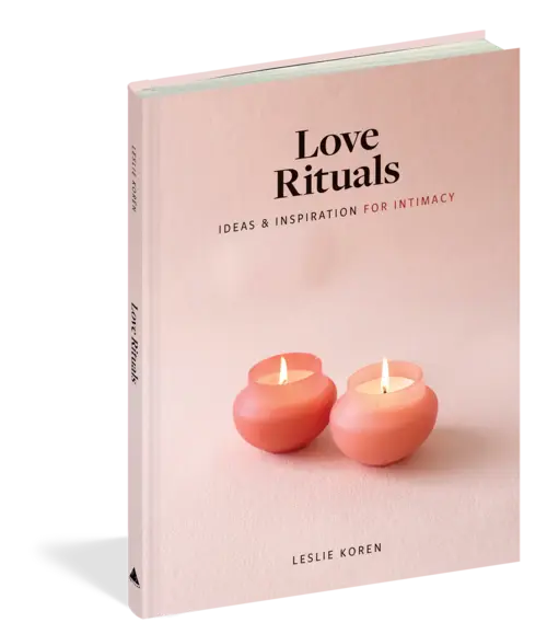 peach colored hardcover book with image of two candles on the cover and the title "Love Rituals"
