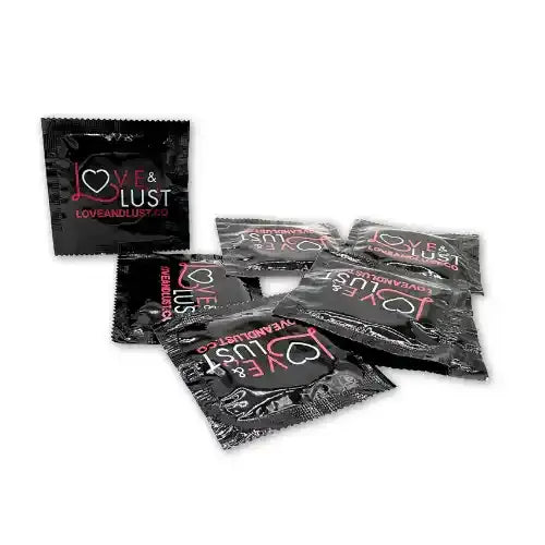 several condoms in black wrappers that says love and lust against white background