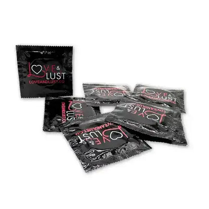 several condoms in black wrappers that says love and lust against white background