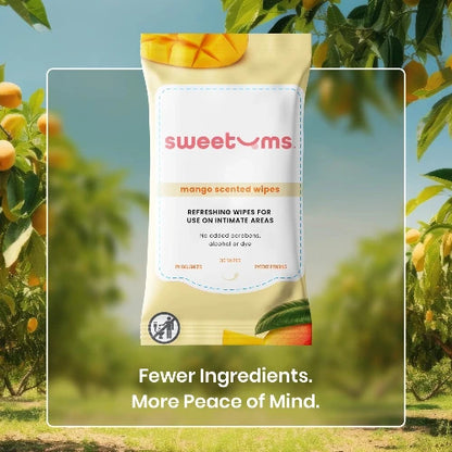 sweetums daily mango wipes in package against tropical background