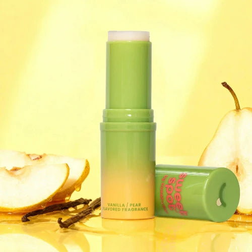 vanilla pear fragrance stick - green applicator with pears in background