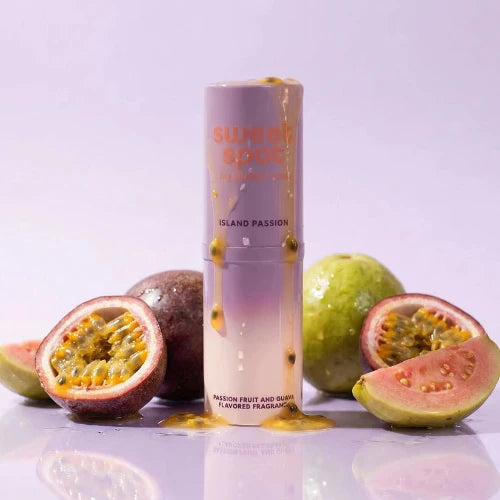 fragrance stick next to passion fruit and guava