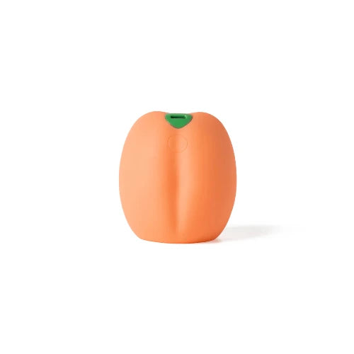 peach stroker toy against white background