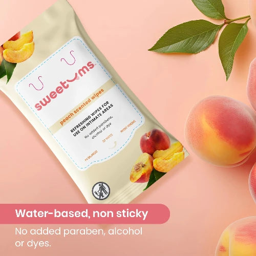 sweetums peach-scented wipes packaging with peaches and leaves on a pink background