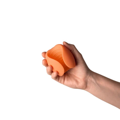 Hand holding peach stroker