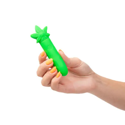hand holding stoni mini vibrator against white background