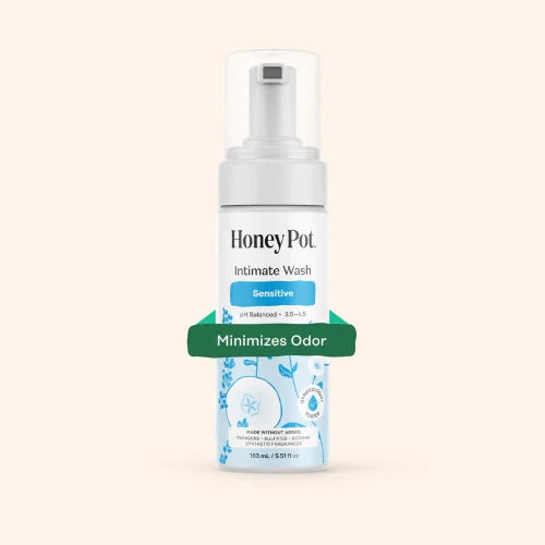 Honey Pot Intimate Wash bottle on a light beige background
