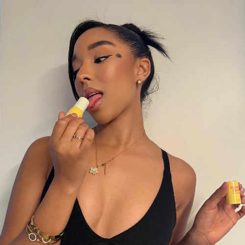 woman licking fragrance stick