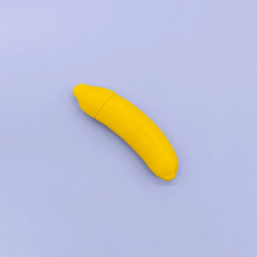 banana vibrator against light purple background