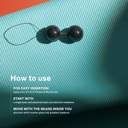 LELO Beads Noir - two black beads lying on blue towel
