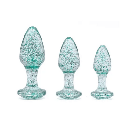 three blue glitter butt plugs in varying sizes against white background
