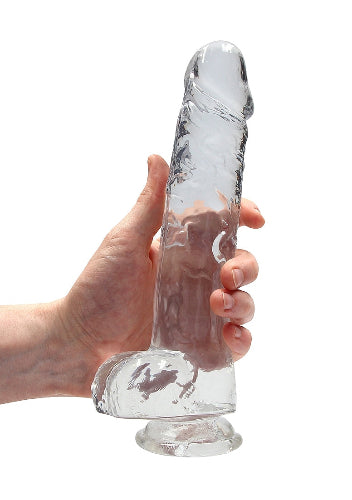 hand cradling crystal clear dildo