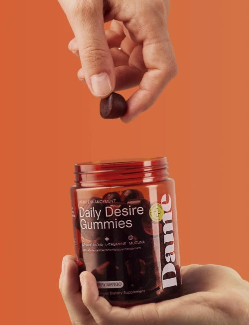 hand holding daily desire gummies 