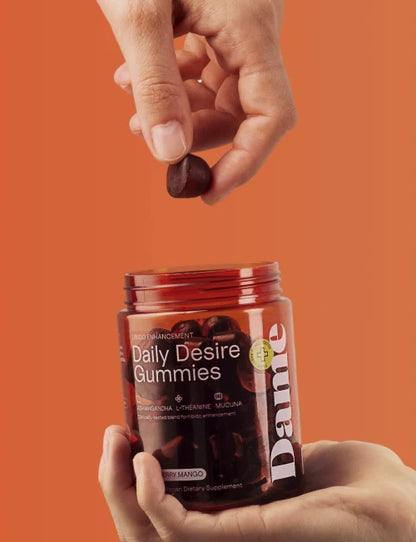 hand holding daily desire gummies 
