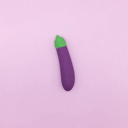 eggplant emoji against purple background