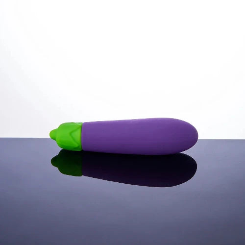 eggplant vibrator against blue and white background