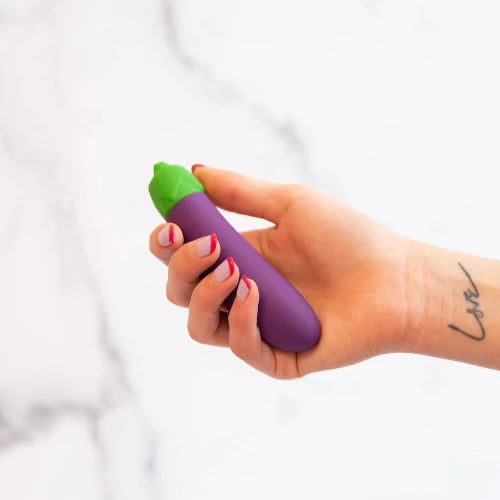 hand holding eggplant vibrator