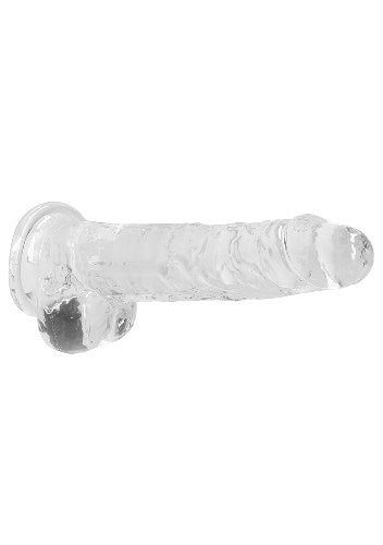 clear dildo against white background