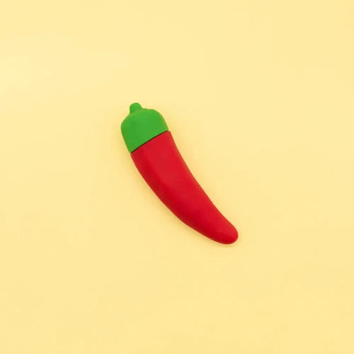 chili pepper vibrator against yellow background