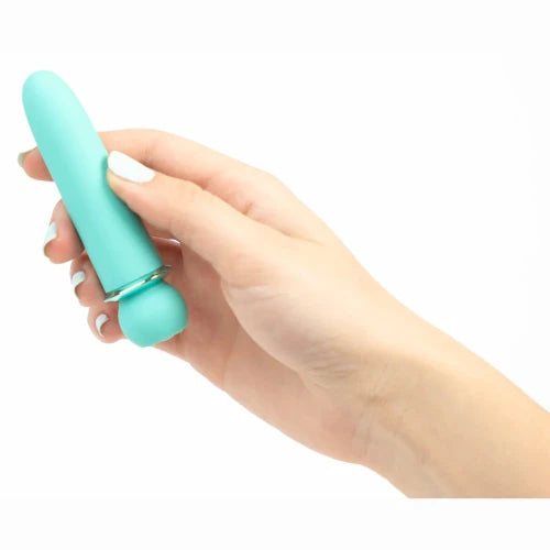 hand holding maia blue vibrator against white background