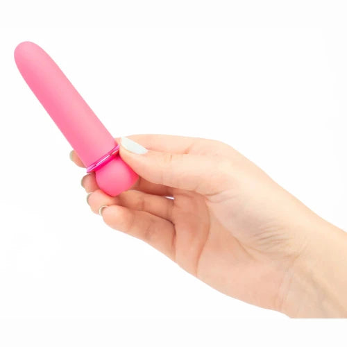 hand holding maia jaguar bullet vibrator - pink - against white background