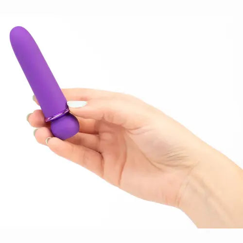 Hand holding Jaguar sleek purple vibrator against white background