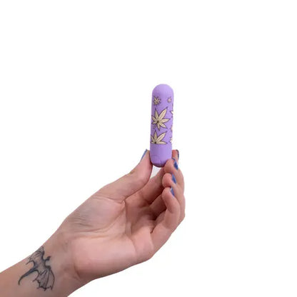 hand holding jessi violet 420 bullet vibe against white background