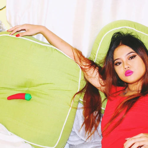 woman posing with chili pepper vibrator