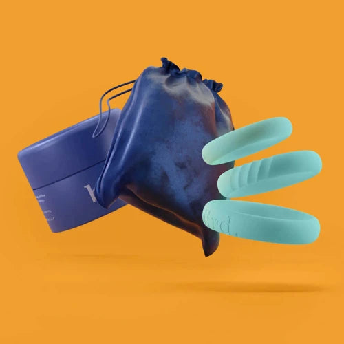 biird set of 3 mint penis rings with blue bag and round blue case - orange background