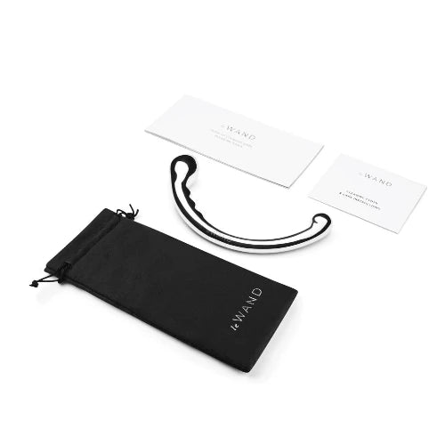 le wand hoop stainless steel massager next to black storage bag and instruction cards